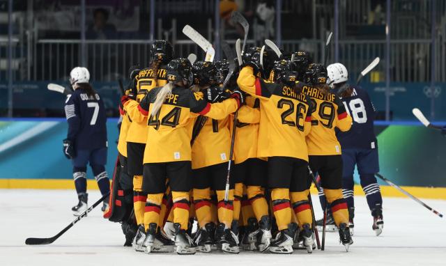 (260209) -- MILAN, Feb. 9, 2026 (Xinhua) -- Players of Germany celebrate after the ice hockey women's preliminary round group B match between Germany and France at the Milan-Cortina 2026 Olympic Winter Games in Milan, Italy, Feb. 9, 2026. (Xinhua/Wang Kaiyan)