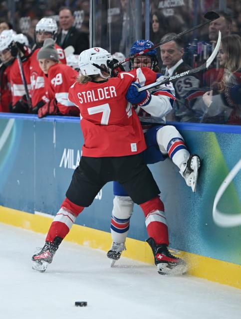 (260209) -- MILAN, Feb. 9, 2026 (Xinhua) -- Lara Stalder (L) of Switzerland vies with Hannah Bilka of the United States during the ice hockey women's preliminary round group A match between Switzerland and the United States at the Milan-Cortina 2026 Olympic Winter Games in Milan, Italy, Feb. 9, 2026. (Xinhua/Zhang Haofu)