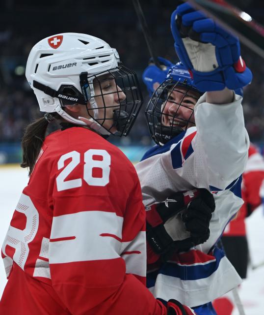 (260209) -- MILAN, Feb. 9, 2026 (Xinhua) -- Haley Winn (R) of the United States celebrates after scoring a goal during the ice hockey women's preliminary round group A match between Switzerland and the United States at the Milan-Cortina 2026 Olympic Winter Games in Milan, Italy, Feb. 9, 2026. (Xinhua/Zhang Haofu)