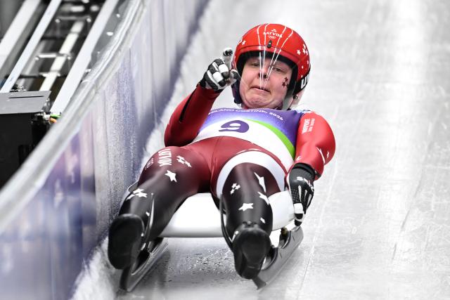 (260209) -- CORTINA D'AMPEZZO, Feb. 9, 2026 (Xinhua) -- Kendija Aparjode of Latvia competes during the luge women's singles run 1 at the Milan-Cortina 2026 Olympic Winter Games in Cortina, Italy, Feb. 9, 2026. (Xinhua/Lian Yi)