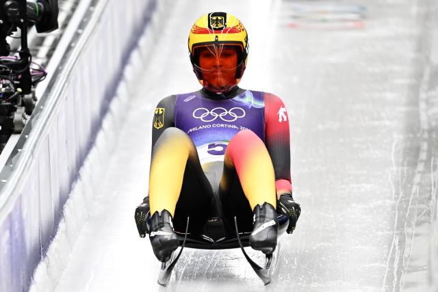 (260209) -- CORTINA D'AMPEZZO, Feb. 9, 2026 (Xinhua) -- Merle Malou Fraebel of Germany competes during the luge women's singles run 1 at the Milan-Cortina 2026 Olympic Winter Games in Cortina, Italy, Feb. 9, 2026. (Xinhua/Lian Yi)