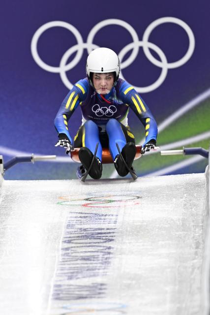 (260209) -- CORTINA D'AMPEZZO, Feb. 9, 2026 (Xinhua) -- Yulianna Tunytska of Ukraine competes during the luge women's singles run 1 at the Milan-Cortina 2026 Olympic Winter Games in Cortina, Italy, Feb. 9, 2026. (Xinhua/Lian Yi)