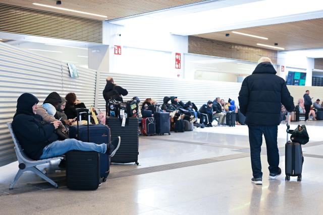 (260209) -- MADRID, Feb. 9, 2026 (Xinhua) -- Passengers wait at a railway station during a train drivers' strike in Madrid, Spain, Feb. 9, 2026. Unions representing Spain's train drivers on Monday announced the cancellation of the second and third days of strike action planned for Tuesday and Wednesday following talks with the Ministry of Transport. The strike, scheduled from Feb. 9 to 11, was called to demand improved safety measures in the wake of recent rail accidents. (Photo by Gustavo Valiente/Xinhua)