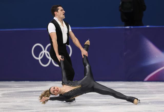 (260210) -- MILAN, Feb. 10, 2026 (Xinhua) -- Marie-Jade Lauriault (bottom)/Romain Le Gac of Canada perform during the rhythm dance of figure skating ice dance competition at the Milan-Cortina 2026 Olympic Winter Games in Milan, Italy, Feb. 9, 2026. (Xinhua/Chen Yichen)