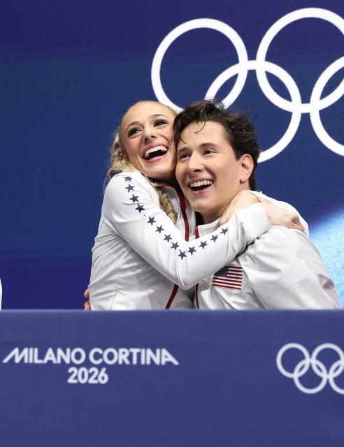 (260210) -- MILAN, Feb. 10, 2026 (Xinhua) -- Emilea Zingas (L)/Vadym Kolesnik of the United States attend the rhythm dance of figure skating ice dance competition at the Milan-Cortina 2026 Olympic Winter Games in Milan, Italy, Feb. 9, 2026. (Xinhua/Chen Yichen)