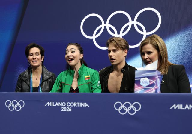 (260210) -- MILAN, Feb. 10, 2026 (Xinhua) -- Allison Reed (2nd L)/Saulius Ambrulevicius (2nd R) of Lithuania attend the rhythm dance of figure skating ice dance competition at the Milan-Cortina 2026 Olympic Winter Games in Milan, Italy, Feb. 9, 2026. (Xinhua/Chen Yichen)
