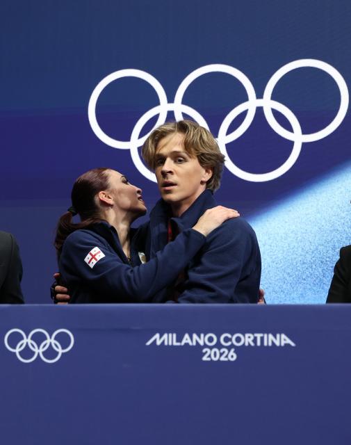 (260210) -- MILAN, Feb. 10, 2026 (Xinhua) -- Diana Davis (L)/Gleb Smolkin of Georgia attend the rhythm dance of figure skating ice dance competition at the Milan-Cortina 2026 Olympic Winter Games in Milan, Italy, Feb. 9, 2026. (Xinhua/Chen Yichen)