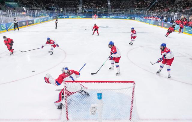 (260210) -- MILAN, Feb. 10, 2026 (Xinhua) -- Goalkeeper Michaela Hesova (bottom) of the Czech Republic saves a goal during the ice hockey women's preliminary round group A match between Canada and the Czech Republic at the Milan-Cortina 2026 Olympic Winter Games in Milan, Italy, Feb. 9, 2026. (Xinhua/Sun Fei)