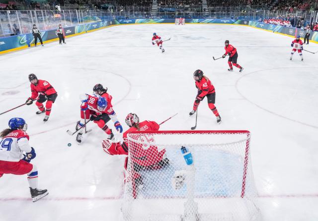 (260210) -- MILAN, Feb. 10, 2026 (Xinhua) -- Kristyna Kaltounkova(3rd L) of the Czech Republic breaks through during the ice hockey women's preliminary round group A match between Canada and the Czech Republic at the Milan-Cortina 2026 Olympic Winter Games in Milan, Italy, Feb. 9, 2026. (Xinhua/Sun Fei)