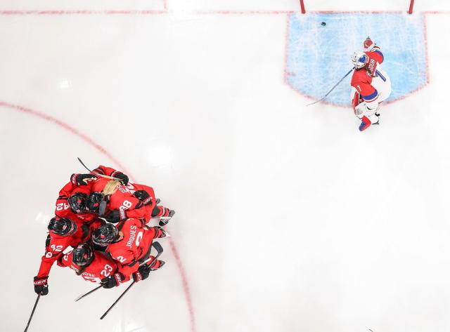 (260210) -- MILAN, Feb. 10, 2026 (Xinhua) -- Players of Canada celebrate a goal during the ice hockey women's preliminary round group A match between Canada and the Czech Republic at the Milan-Cortina 2026 Olympic Winter Games in Milan, Italy, Feb. 9, 2026. (Xinhua/Sun Fei)