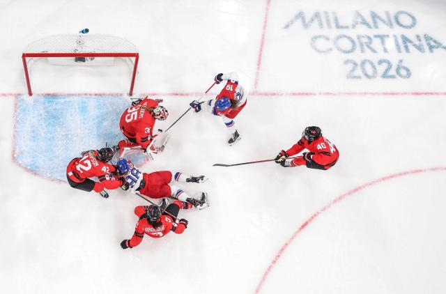 (260210) -- MILAN, Feb. 10, 2026 (Xinhua) -- Natalie Mlynkova(2nd R) of the Czech Republic shoots during the ice hockey women's preliminary round group A match between Canada and the Czech Republic at the Milan-Cortina 2026 Olympic Winter Games in Milan, Italy, Feb. 9, 2026. (Xinhua/Sun Fei)