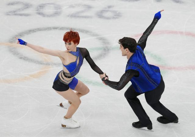 (260210) -- MILAN, Feb. 10, 2026 (Xinhua) -- Evgeniia Lopareva (L)/Geoffrey Brissaud of France perform during the rhythm dance of figure skating ice dance competition at the Milan-Cortina 2026 Olympic Winter Games in Milan, Italy, Feb. 9, 2026. (Xinhua/Xue Yuge)