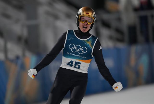 (260210) -- PREDAZZO, Feb. 10, 2026 (Xinhua) -- Philipp Raimund of Germany celebrates during the Ski Jumping Men's Normal Hill Individual of the 2026 Milan-Cortina Winter Olympics in Predazzo, Italy, Feb. 9, 2026. (Xinhua/Meng Yongmin)