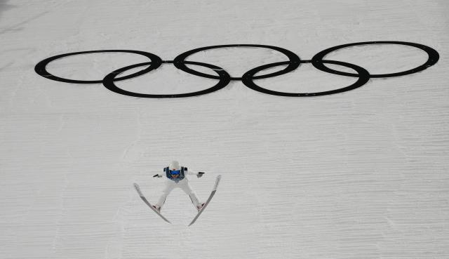 (260210) -- PREDAZZO, Feb. 10, 2026 (Xinhua) -- Song Qiwu of China competes during the Ski Jumping Men's Normal Hill Individual of the 2026 Milan-Cortina Winter Olympics in Predazzo, Italy, Feb. 9, 2026. (Xinhua/Meng Yongmin)