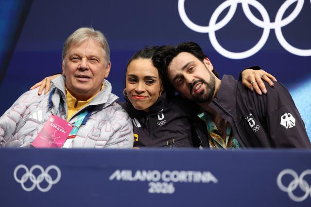 (260209) -- MILAN, Feb. 9, 2026 (Xinhua) -- Jennifer Janse van Rensburg (C)/Benjamin Steffan (R) of Germany attend the rhythm dance of figure skating ice dance competition at the Milan-Cortina 2026 Olympic Winter Games in Milan, Italy, Feb. 9, 2026. (Xinhua/Chen Yichen)