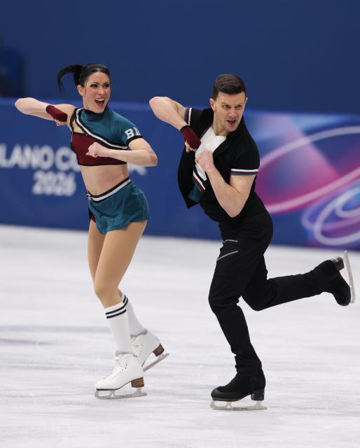 (260210) -- MILAN, Feb. 10, 2026 (Xinhua) -- Charlene Guignard (L)/Marco Fabbri of Italy perform during the rhythm dance of figure skating ice dance competition at the Milan-Cortina 2026 Olympic Winter Games in Milan, Italy, Feb. 9, 2026. (Xinhua/Chen Yichen)