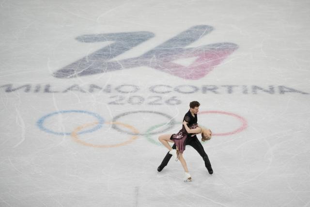 (260210) -- MILAN, Feb. 10, 2026 (Xinhua) -- Juulia Turkkila (front)/Matthias Versluis of Finland perform during the rhythm dance of figure skating ice dance competition at the Milan-Cortina 2026 Olympic Winter Games in Milan, Italy, Feb. 9, 2026. (Xinhua/Xue Yuge)
