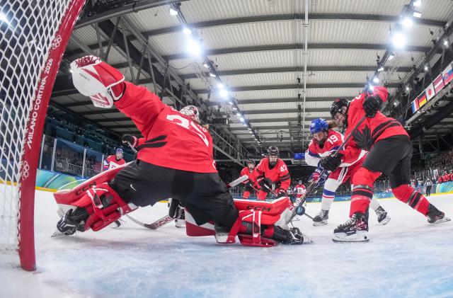 (260210) -- MILAN, Feb. 10, 2026 (Xinhua) -- Mlynkova Natalie (2nd R) of the Czech Republic shoots to score during the ice hockey women's preliminary round group A match between Canada and the Czech Republic at the Milan-Cortina 2026 Olympic Winter Games in Milan, Italy, Feb. 9, 2026. (Sun Fei/Pool via Xinhua)