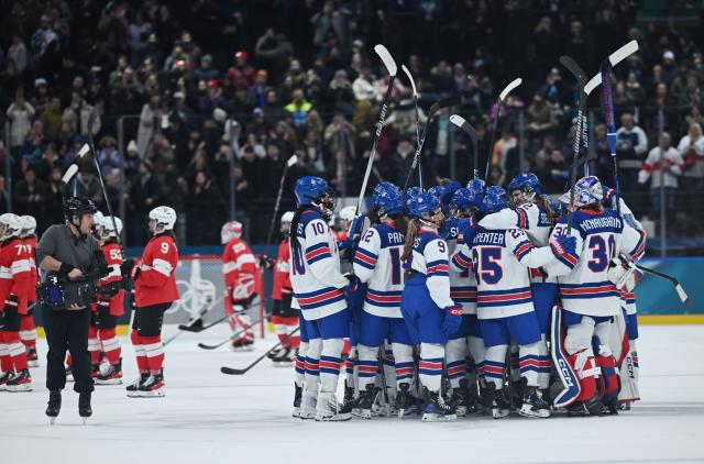 (260210) -- MILAN, Feb. 10, 2026 (Xinhua) -- Players of the United States celebrate winning the ice hockey women's preliminary round group A match between Switzerland and the United States at the Milan-Cortina 2026 Olympic Winter Games in Milan, Italy, Feb. 9, 2026. (Xinhua/Zhang Haofu)