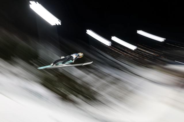 (260210) -- PREDAZZO, Feb. 10, 2026 (Xinhua) -- Alex Insam of Italy competes during the Ski Jumping Men's Normal Hill Individual of the 2026 Milan-Cortina Winter Olympics in Predazzo, Italy, Feb. 9, 2026. (Xinhua/Huang Wei)