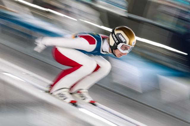 (260210) -- PREDAZZO, Feb. 10, 2026 (Xinhua) -- Daniel Tschofenig of Austria competes during the Ski Jumping Men's Normal Hill Individual of the 2026 Milan-Cortina Winter Olympics in Predazzo, Italy, Feb. 9, 2026. (Xinhua/Huang Wei)