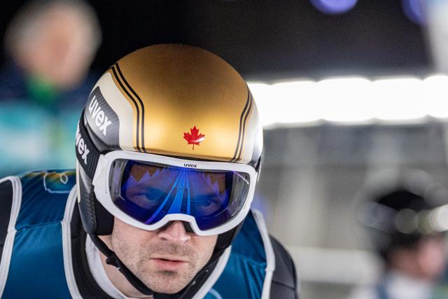 (260210) -- PREDAZZO, Feb. 10, 2026 (Xinhua) -- Mackenzie Boyd-Clowes of Canada competes during the Ski Jumping Men's Normal Hill Individual of the 2026 Milan-Cortina Winter Olympics in Predazzo, Italy, Feb. 9, 2026. (Xinhua/Huang Wei)