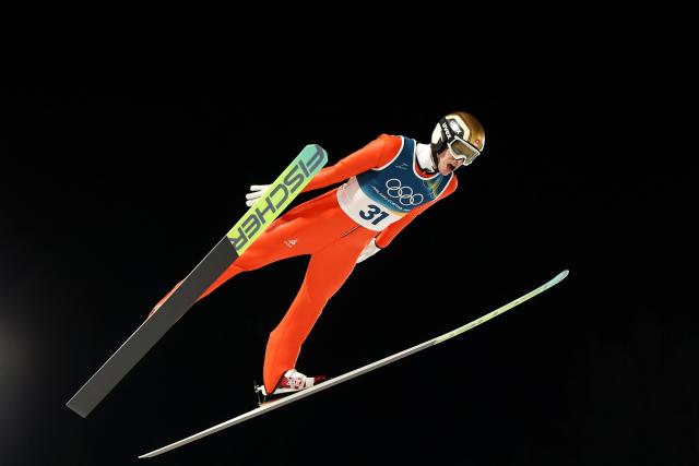 (260210) -- PREDAZZO, Feb. 10, 2026 (Xinhua) -- Gregor Deschwanden of Switzerland competes during the Ski Jumping Men's Normal Hill Individual of the 2026 Milan-Cortina Winter Olympics in Predazzo, Italy, Feb. 9, 2026. (Xinhua/Huang Wei)