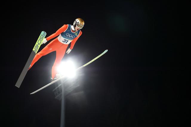 (260210) -- PREDAZZO, Feb. 10, 2026 (Xinhua) -- Gregor Deschwanden of Switzerland competes during the Ski Jumping Men's Normal Hill Individual of the 2026 Milan-Cortina Winter Olympics in Predazzo, Italy, Feb. 9, 2026. (Xinhua/Huang Wei)