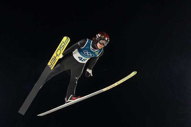 (260210) -- PREDAZZO, Feb. 10, 2026 (Xinhua) -- Nikaido Ren of Japan competes during the Ski Jumping Men's Normal Hill Individual of the 2026 Milan-Cortina Winter Olympics in Predazzo, Italy, Feb. 9, 2026. (Xinhua/Huang Wei)