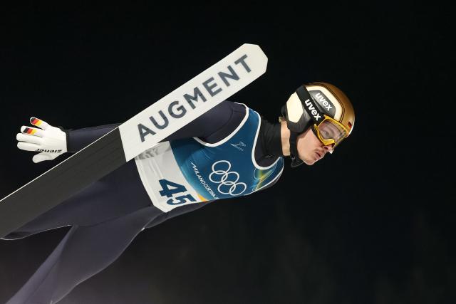 (260210) -- PREDAZZO, Feb. 10, 2026 (Xinhua) -- Philipp Raimund of Germany competes during the Ski Jumping Men's Normal Hill Individual of the 2026 Milan-Cortina Winter Olympics in Predazzo, Italy, Feb. 9, 2026. (Xinhua/Huang Wei)