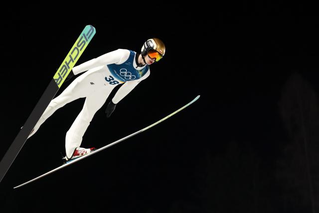 (260210) -- PREDAZZO, Feb. 10, 2026 (Xinhua) -- Kacper Tomasiak of Poland competes during the Ski Jumping Men's Normal Hill Individual of the 2026 Milan-Cortina Winter Olympics in Predazzo, Italy, Feb. 9, 2026. (Xinhua/Huang Wei)