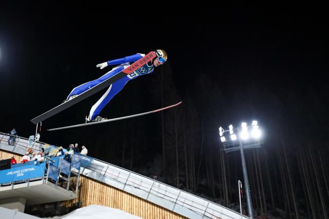 (260210) -- PREDAZZO, Feb. 10, 2026 (Xinhua) -- Timi Zajc of Slovenia competes during the Ski Jumping Men's Normal Hill Individual of the 2026 Milan-Cortina Winter Olympics in Predazzo, Italy, Feb. 9, 2026. (Xinhua/Huang Wei)