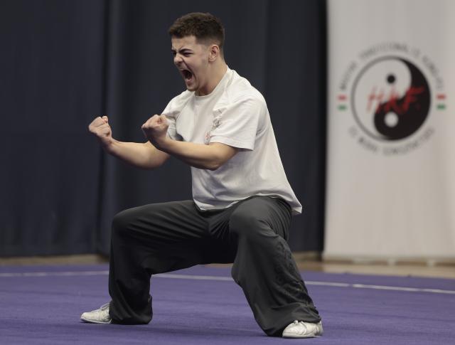 (260210) -- BUDAPEST, Feb. 10, 2026 (Xinhua) -- Diego Negri, a member of the Swiss Wushu Team, showcases his training result during a Wushu training camp in Budapest, Hungary, on Feb. 8, 2026. TO GO WITH 'Feature: Europe's young Wushu athletes sharpen skills as Youth Olympic debut nears' (Photo by Laszlo Balogh/Xinhua)