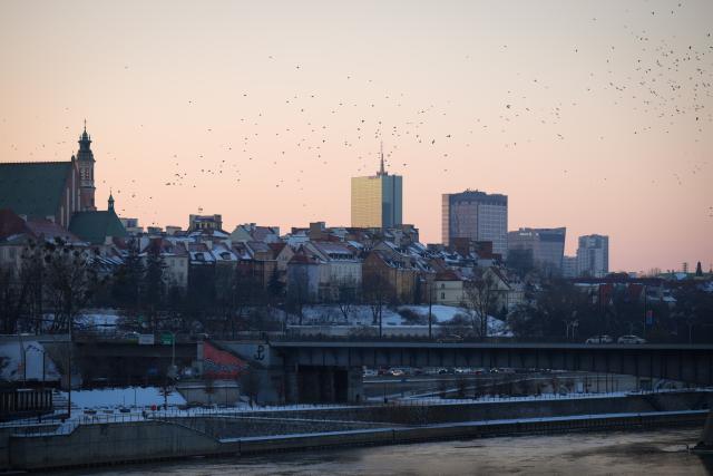 (260210) -- WARSAW, Feb. 10, 2026 (Xinhua) -- Old Town buildings are seen against the backdrop of modern skyscrapers at sunset in Warsaw, Poland, on Feb. 9, 2026. (Photo by Jaap Arriens/Xinhua)
