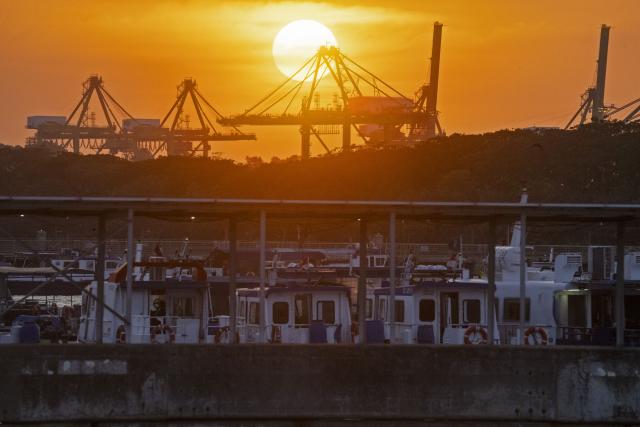 (260210) -- SINGAPORE, Feb. 10, 2026 (Xinhua) -- This photo taken on Feb. 9, 2026 shows the Tanjong Pagar container terminal at sunset in Singapore. Singapore's economy grew by 5 percent in 2025, easing from 5.3 percent in 2024, the Ministry of Trade and Industry said on Tuesday, while raising its growth forecast for 2026 to a range of 2 to 4 percent. (Photo by Then Chih Wey/Xinhua)