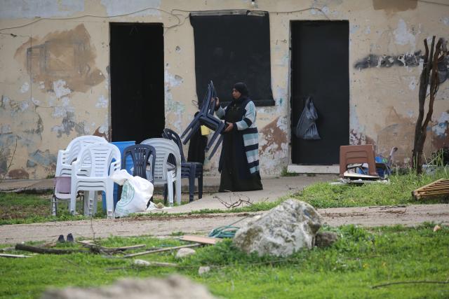 (260210) -- JENIN, Feb. 10, 2026 (Xinhua) -- A Palestinian collects belongings to leave after Israeli forces forced her to evacuate her home in the town of Arraba, south of Jenin city in the West Bank, on Feb. 9, 2026. Israel's recent decisions to deepen control over the West Bank and expand Jewish settlements there have raised broad Palestinian concerns over potential land confiscation and threats to regional stability. (Photo by Nidal Eshtayeh/Xinhua)