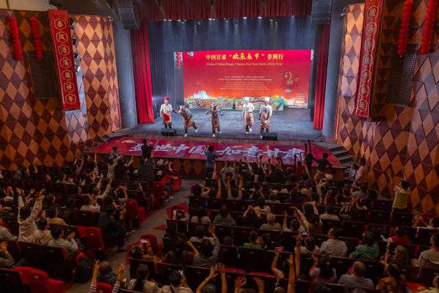 (260210) -- NAIROBI, Feb. 10, 2026 (Xinhua) -- Actors interact with audiences during a performance at the Kenya National Theatre in Nairobi, Kenya, on Feb. 9, 2026. A vibrant cultural show featuring Chinese martial arts, acrobatics and dance was staged here on Monday during the Gansu (China) Happy Chinese New Year Gala: Africa Tour. (Xinhua/Xie Jianfei)