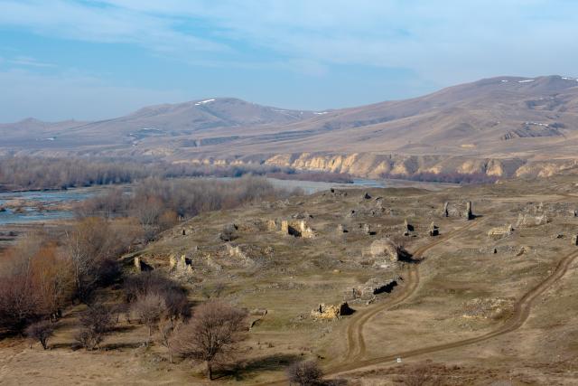 (260210) -- GORI, Feb. 10, 2026 (Xinhua) -- This photo taken on Jan. 30, 2026 shows the ruins of the Uplistsikhe rock-hewn city and its surrounding scenery near Gori, Georgia. The Uplistsikhe rock-hewn city ruins is located on a high rocky hill on the bank of the Kura River near Gori in Georgia. It has been on the UNESCO World Heritage Tentative List since 2007. (Xinhua/Chen Junfeng)