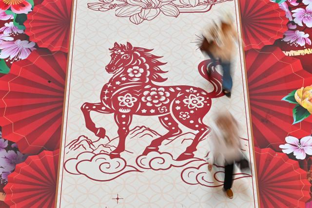 (260210) -- KUALA LUMPUR, Feb. 10, 2026 (Xinhua) -- This photo taken on Jan. 30, 2026 shows a horse decoration for the upcoming Chinese New Year at a mall in Kuala Lumpur, Malaysia. As the Spring Festival approaches, traditional Chinese art of paper-cutting featuring the Year of the Horse increased the festive atmosphere in Malaysia. (Photo by Chong Voon Chung/Xinhua)