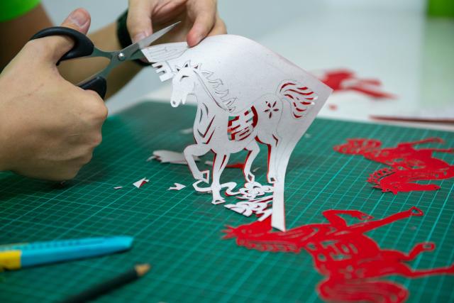 (260210) -- KUALA LUMPUR, Feb. 10, 2026 (Xinhua) -- A craftsman creates a paper-cutting artwork of the Year of the Horse in Kuala Lumpur, Malaysia, Jan. 26, 2026. As the Spring Festival approaches, traditional Chinese art of paper-cutting featuring the Year of the Horse increased the festive atmosphere in Malaysia. (Photo by Chong Voon Chung/Xinhua)