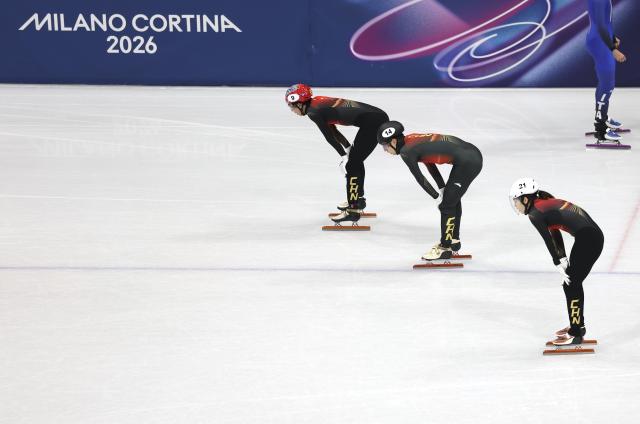(260210) -- MILAN, Feb. 10, 2026 (Xinhua) -- Sun Long, Liu Shaoang and Zhang Chutong (L-R) of China react after the short track speed skating mixed team relay final A at the Milan-Cortina 2026 Olympic Winter Games in Milan, Italy, Feb. 10, 2026. (Xinhua/Hu Xingyu)