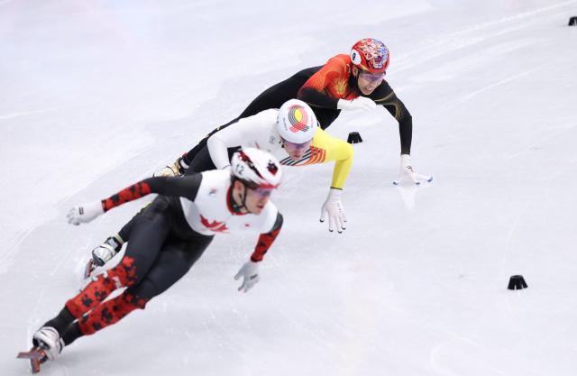 (260210) -- MILAN, Feb. 10, 2026 (Xinhua) -- Sun Long (top) of China competes during the short track speed skating mixed team relay final A at the Milan-Cortina 2026 Olympic Winter Games in Milan, Italy, Feb. 10, 2026. (Xinhua/Chen Yichen)