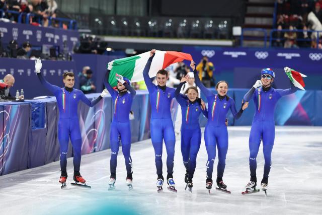 (260210) -- MILAN, Feb. 10, 2026 (Xinhua) -- Members of team Italy celebrate after the short track speed skating mixed team relay final A at the Milan-Cortina 2026 Olympic Winter Games in Milan, Italy, Feb. 10, 2026. (Xinhua/Li Ming)