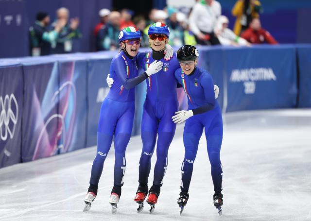 (260210) -- MILAN, Feb. 10, 2026 (Xinhua) -- Members of team Italy celebrate after the short track speed skating mixed team relay final A at the Milan-Cortina 2026 Olympic Winter Games in Milan, Italy, Feb. 10, 2026. (Xinhua/Li Ming)