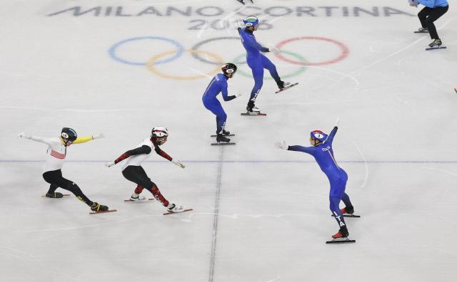 (260210) -- MILAN, Feb. 10, 2026 (Xinhua) -- Members of team Italy celebrate after the short track speed skating mixed team relay final A at the Milan-Cortina 2026 Olympic Winter Games in Milan, Italy, Feb. 10, 2026. (Xinhua/Hu Xingyu)