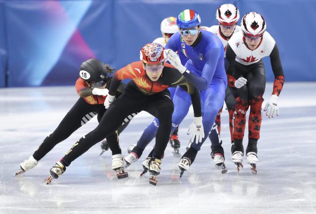 (260210) -- MILAN, Feb. 10, 2026 (Xinhua) -- Gong Li (1st L) and Sun Long (2nd L) of China compete during the short track speed skating mixed team relay final A at the Milan-Cortina 2026 Olympic Winter Games in Milan, Italy, Feb. 10, 2026. (Xinhua/Li Ming)