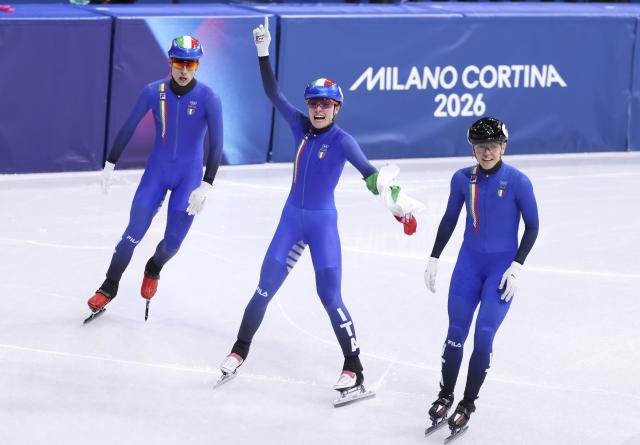 (260210) -- MILAN, Feb. 10, 2026 (Xinhua) -- Members of team Italy celebrate after the short track speed skating mixed team relay final A at the Milan-Cortina 2026 Olympic Winter Games in Milan, Italy, Feb. 10, 2026. (Xinhua/Chen Yichen)