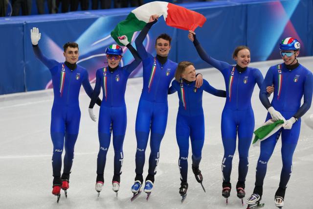 (260210) -- MILAN, Feb. 10, 2026 (Xinhua) -- Members of team Italy celebrate after the short track speed skating mixed team relay final A at the Milan-Cortina 2026 Olympic Winter Games in Milan, Italy, Feb. 10, 2026. (Xinhua/Na Yuqi)