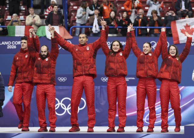 (260210) -- MILAN, Feb. 10, 2026 (Xinhua) -- Silver medalists team Canada react during the awarding ceremony for the short track speed skating mixed team relay at the Milan-Cortina 2026 Olympic Winter Games in Milan, Italy, Feb. 10, 2026. (Xinhua/Li Ming)