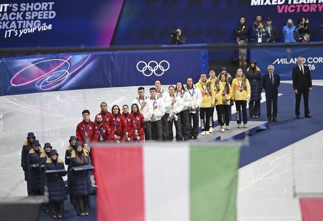 (260210) -- MILAN, Feb. 10, 2026 (Xinhua) -- Gold medalists team Italy (C), silver medalists team Canada and bronze medalists team Belgium are seen during the awarding ceremony for the short track speed skating mixed team relay at the Milan-Cortina 2026 Olympic Winter Games in Milan, Italy, Feb. 10, 2026. (Xinhua/Cheng Min)